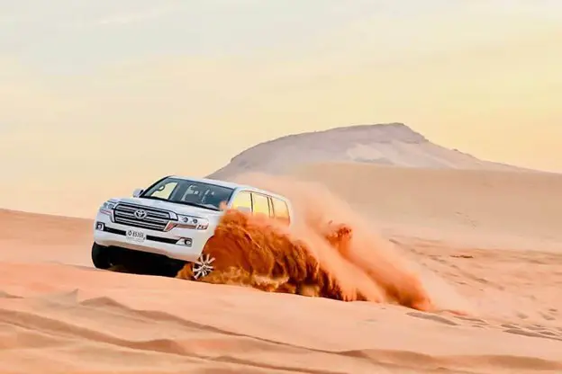Standard Evening Desert Safari camp at sunset